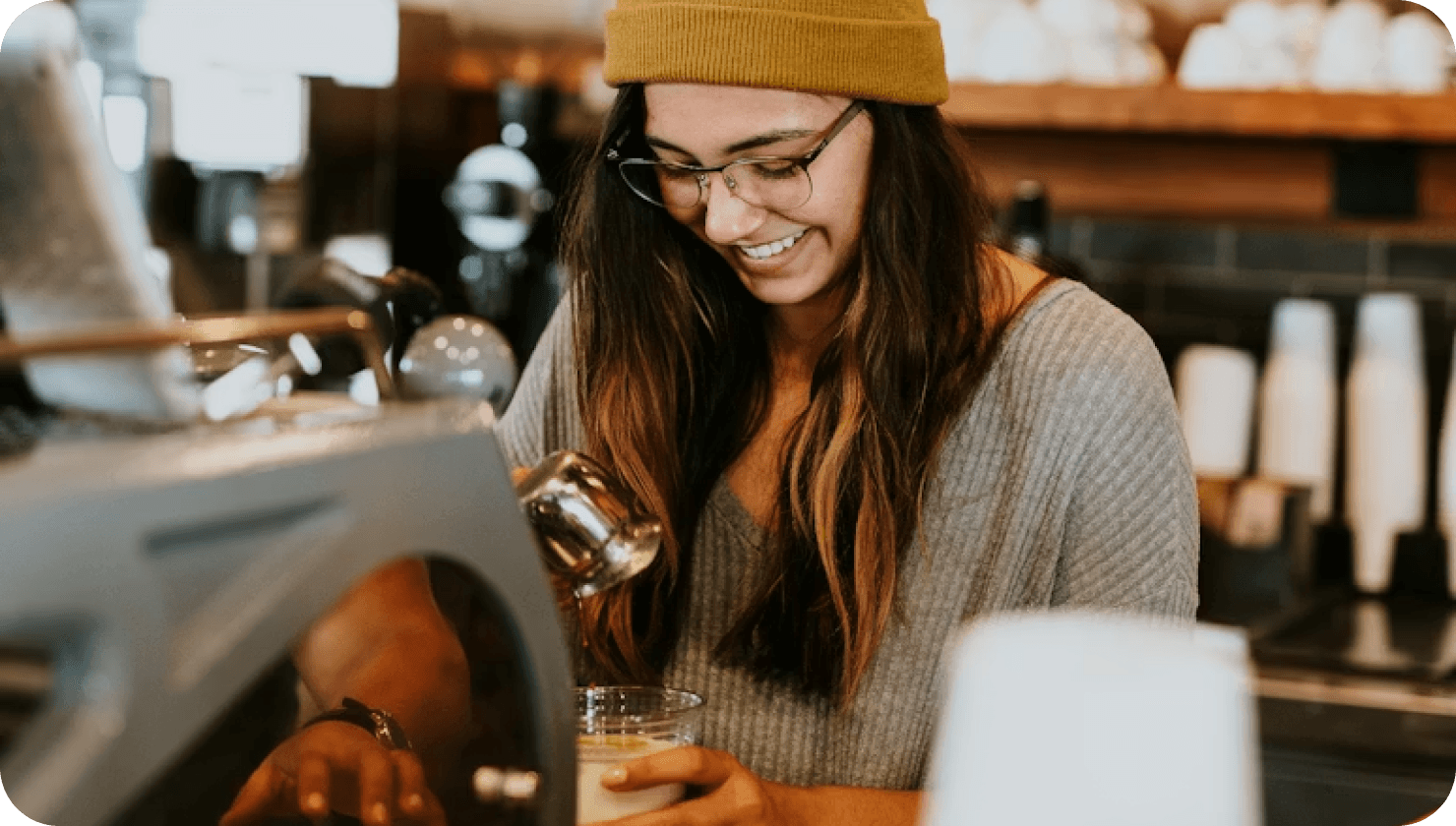 a female brewing coffee